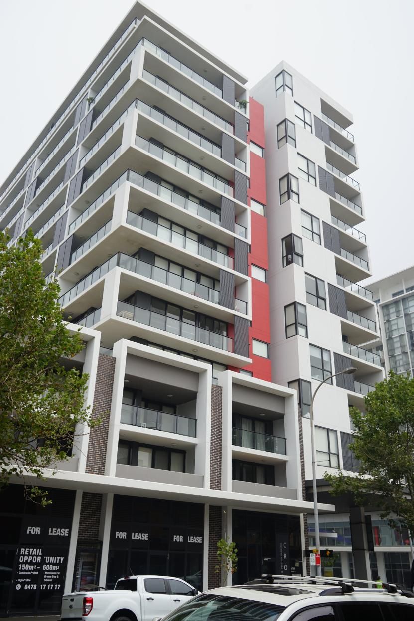 A Tall Building With A Lot Of Balconies And Cars Parked In Front Of It — Rendering By Yilmaz P/L In Thirroul, NSW