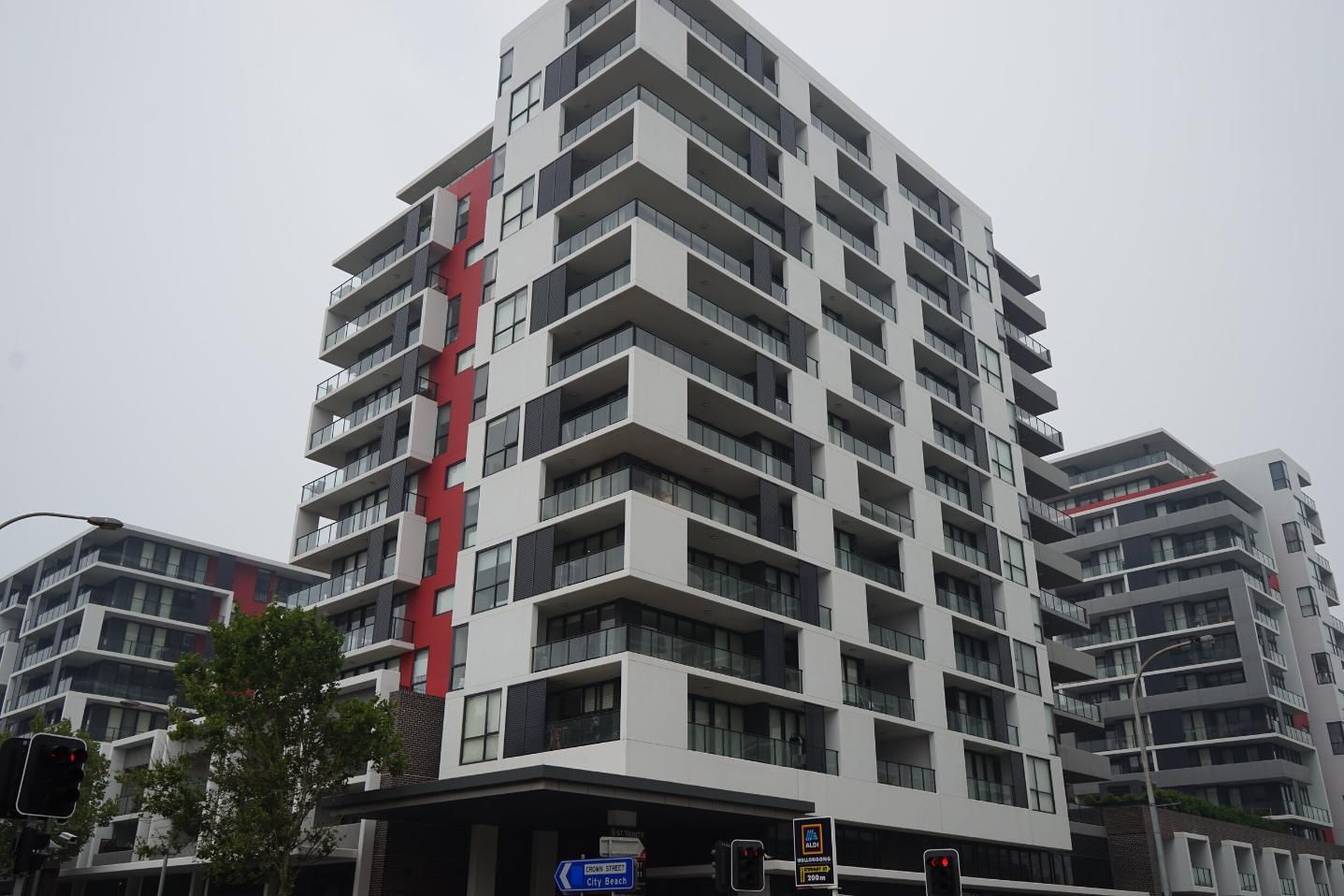 A Tall Building With A Lot Of Windows And Balconies — Rendering By Yilmaz P/L In Dapto, NSW