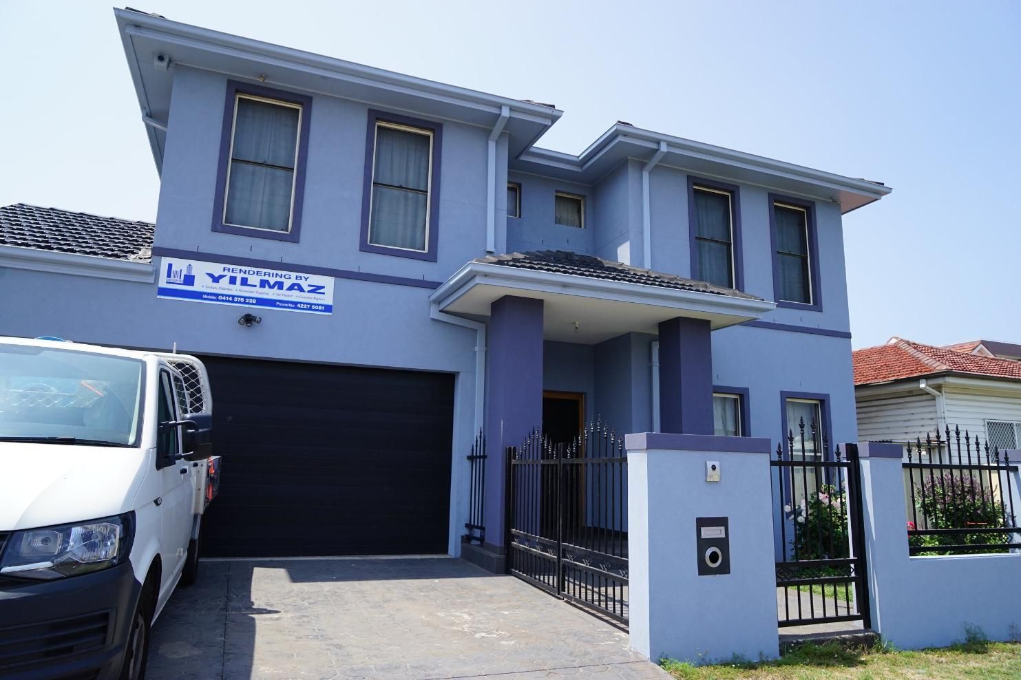 A Blue House With A White Van Parked In Front Of It — Rendering By Yilmaz P/L In Thirroul, NSW
