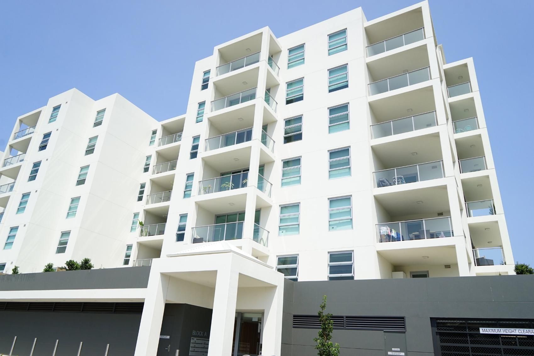 A Large White Apartment Building With Lots Of Balconies — Rendering By Yilmaz P/L In Albion Park, NSW