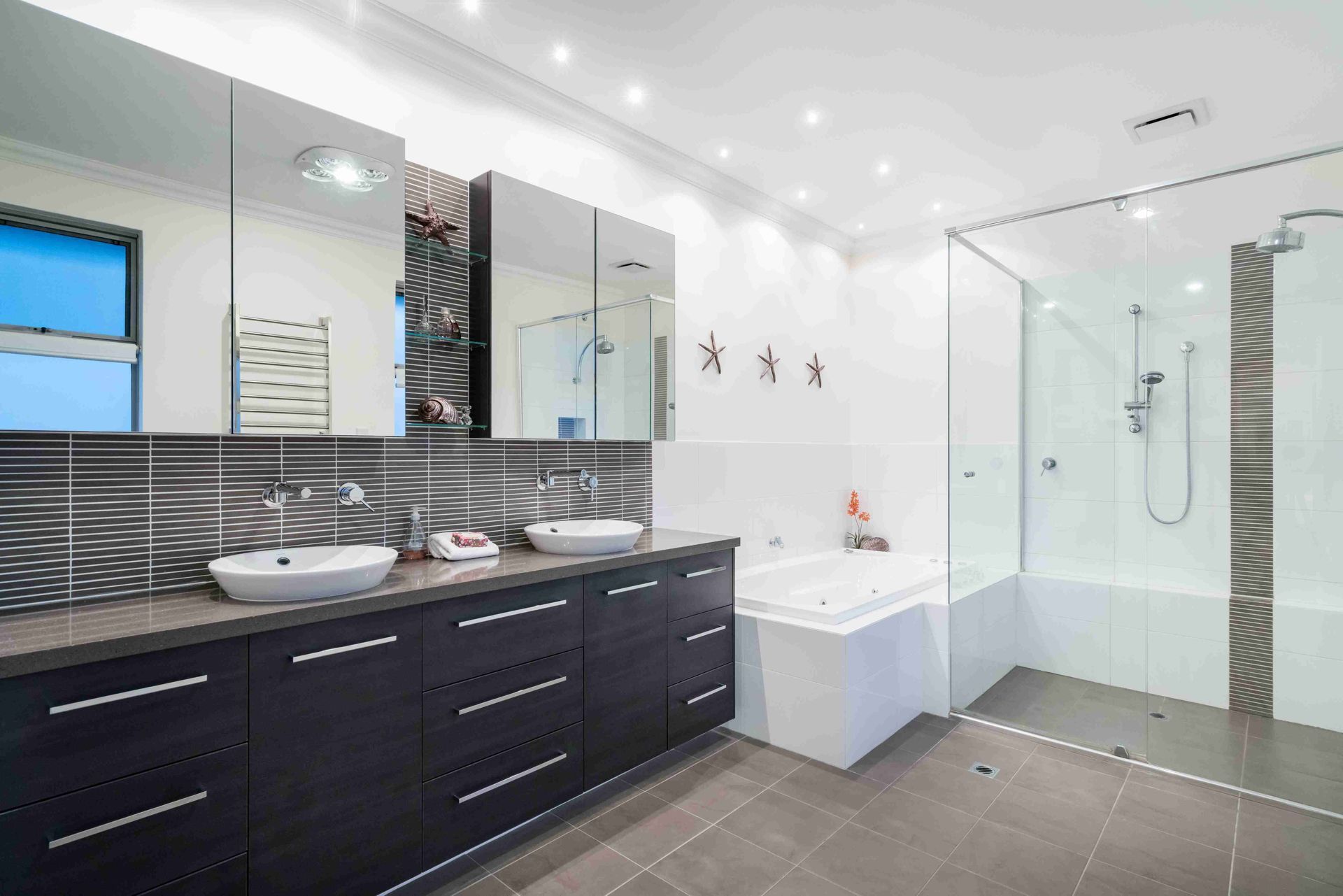 A Bathroom With Two Sinks, a Bathtub, and a Walk in Shower — Suncoast Kitchens In Kunda Park, QLD