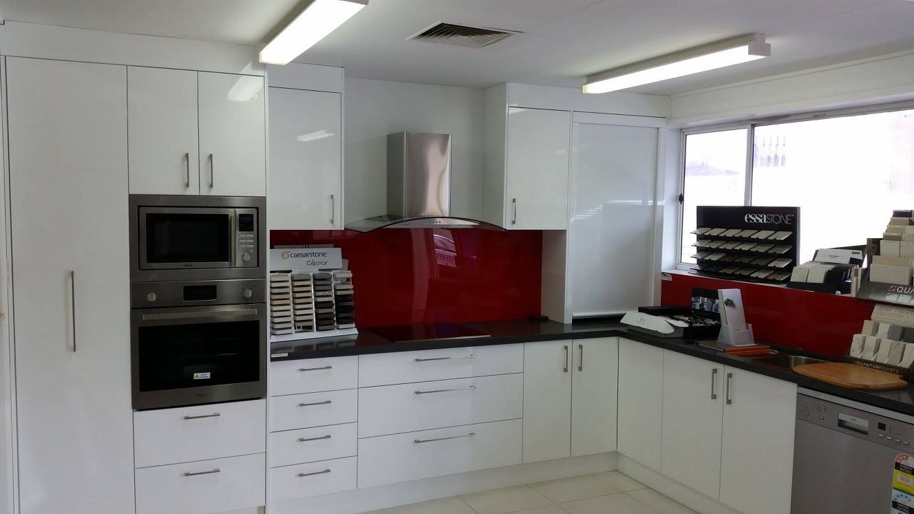 A Kitchen With White Cabinets and Stainless Steel Appliances — Suncoast Kitchens In Tanawha, QLD