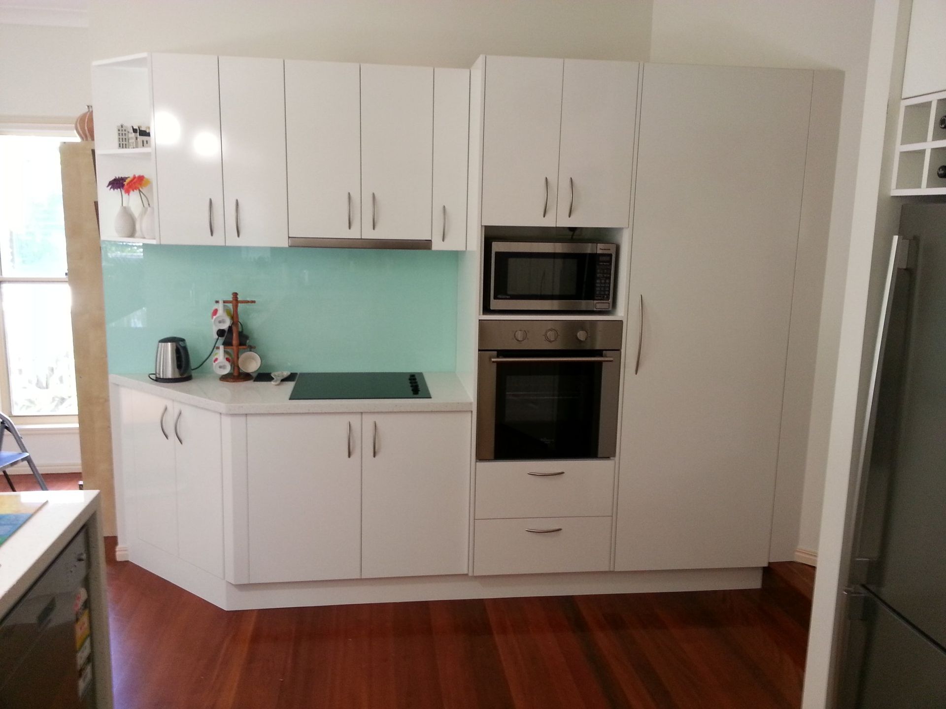 A Kitchen With White Cabinets and Stainless Steel Appliances — Suncoast Kitchens In Bli Bli, QLD