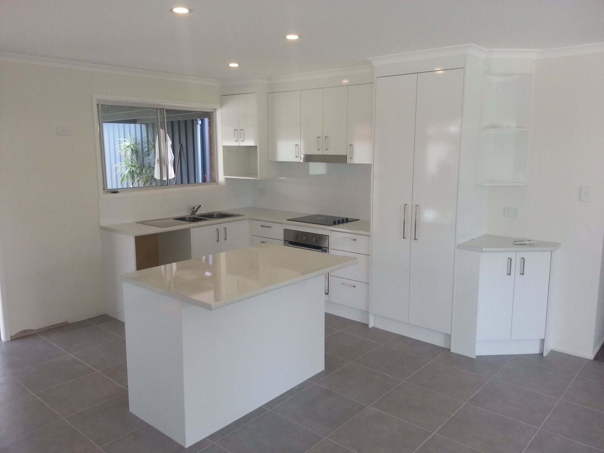 There is a Large Island in the Middle of the Kitchen — Suncoast Kitchens In Buderim, QLD