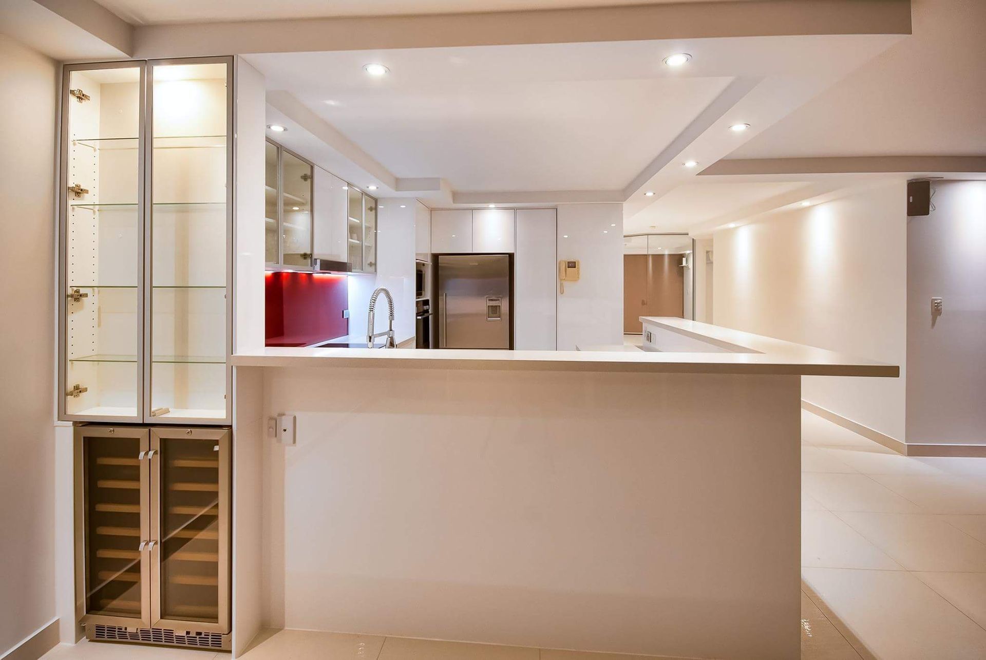A Kitchen With a Stainless Steel Refrigerator and a Wine Cooler — Suncoast Kitchens In Kunda Park, QLD