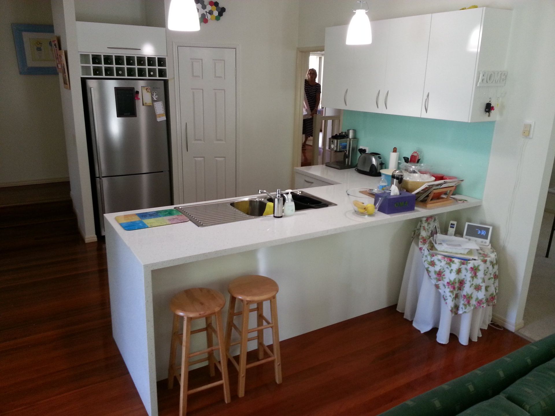 A Kitchen With White Cabinets and a Stainless Steel Refrigerator — Suncoast Kitchens In Bli Bli, QLD