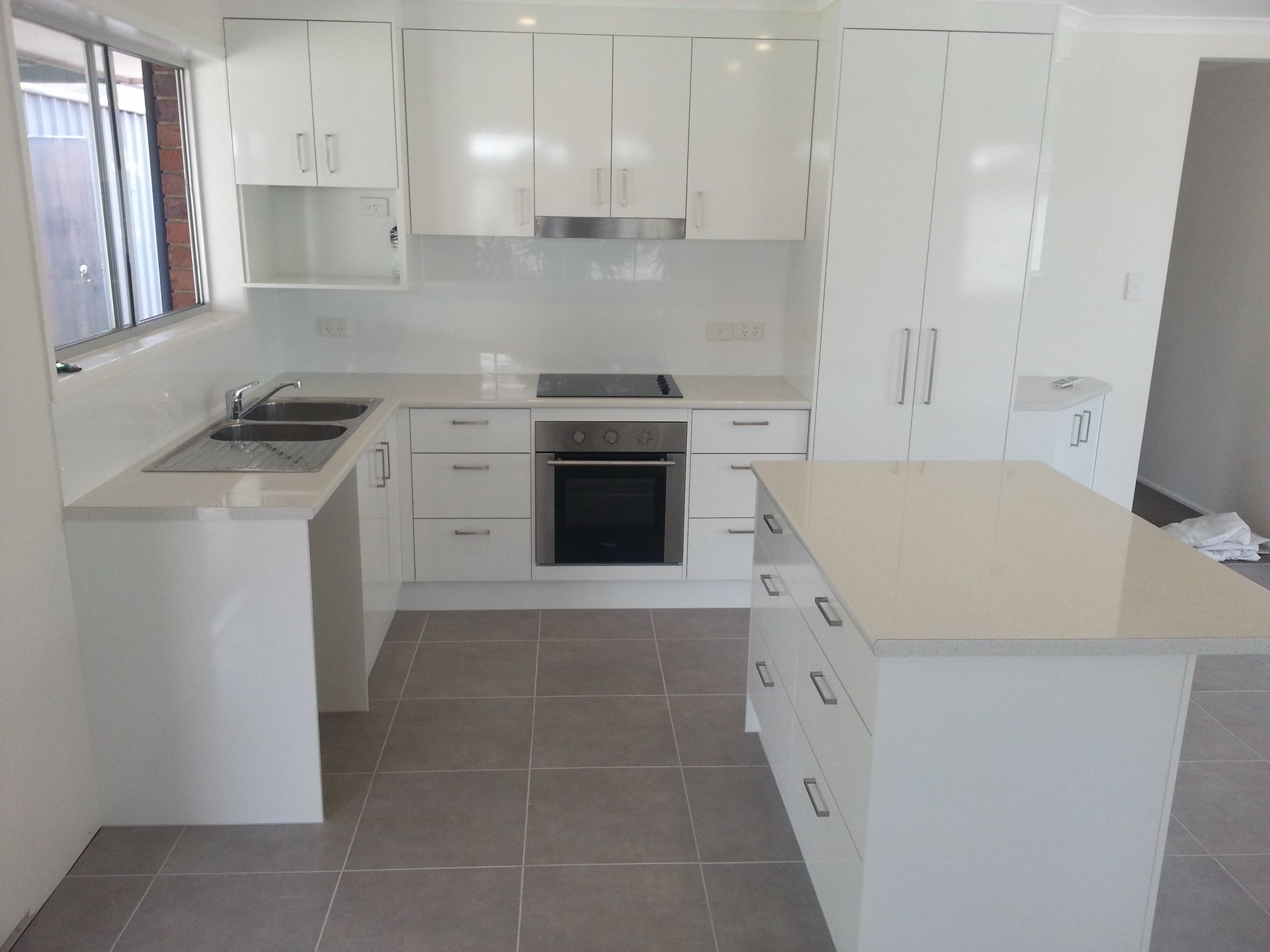 A Kitchen With White Cabinets and Stainless Steel Appliances — Suncoast Kitchens In Buderim, QLD