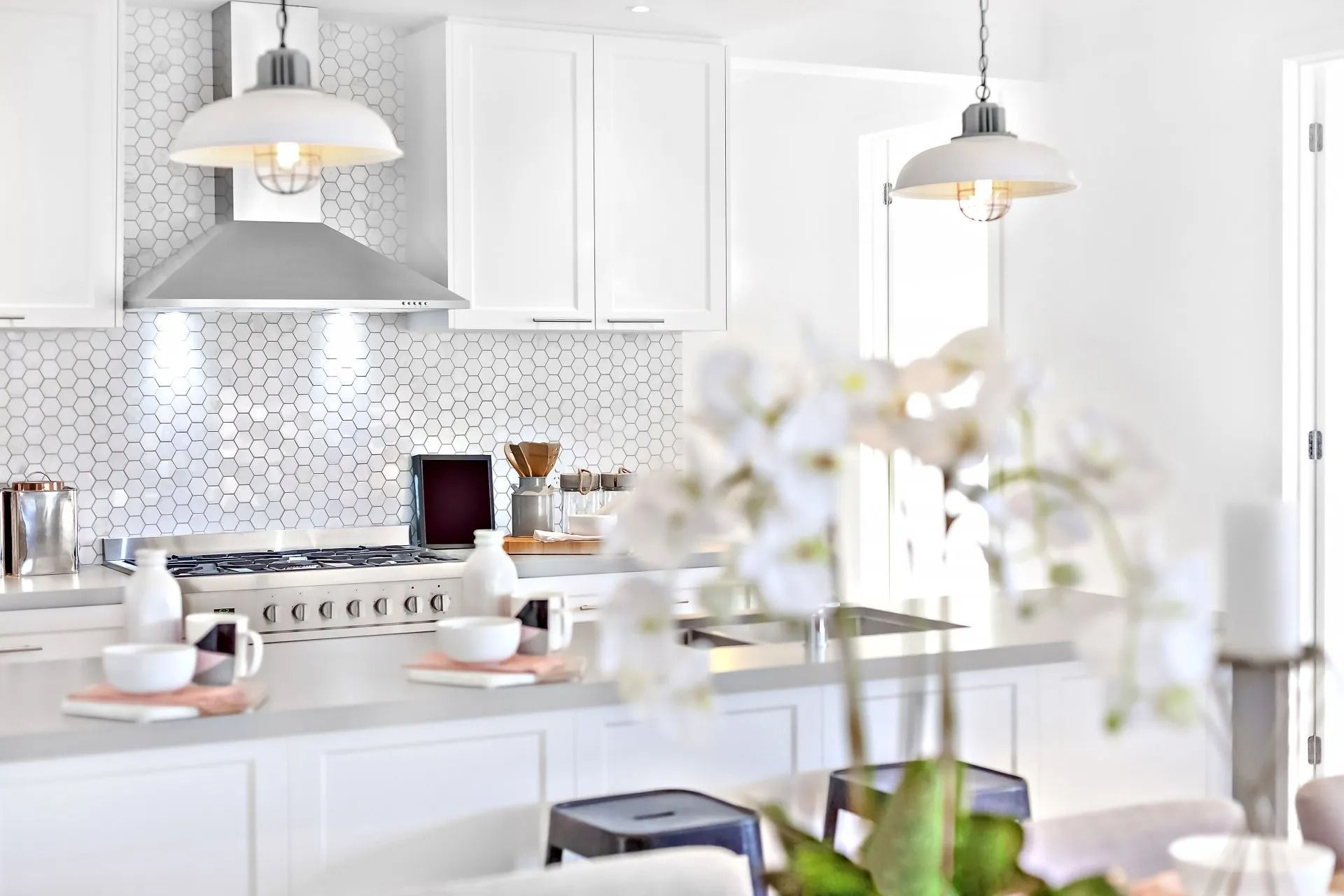 A Kitchen With White Cabinets and a Stove Top Oven — Suncoast Kitchens In Kunda Park, QLD