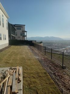 A house on a hill with a view of the city