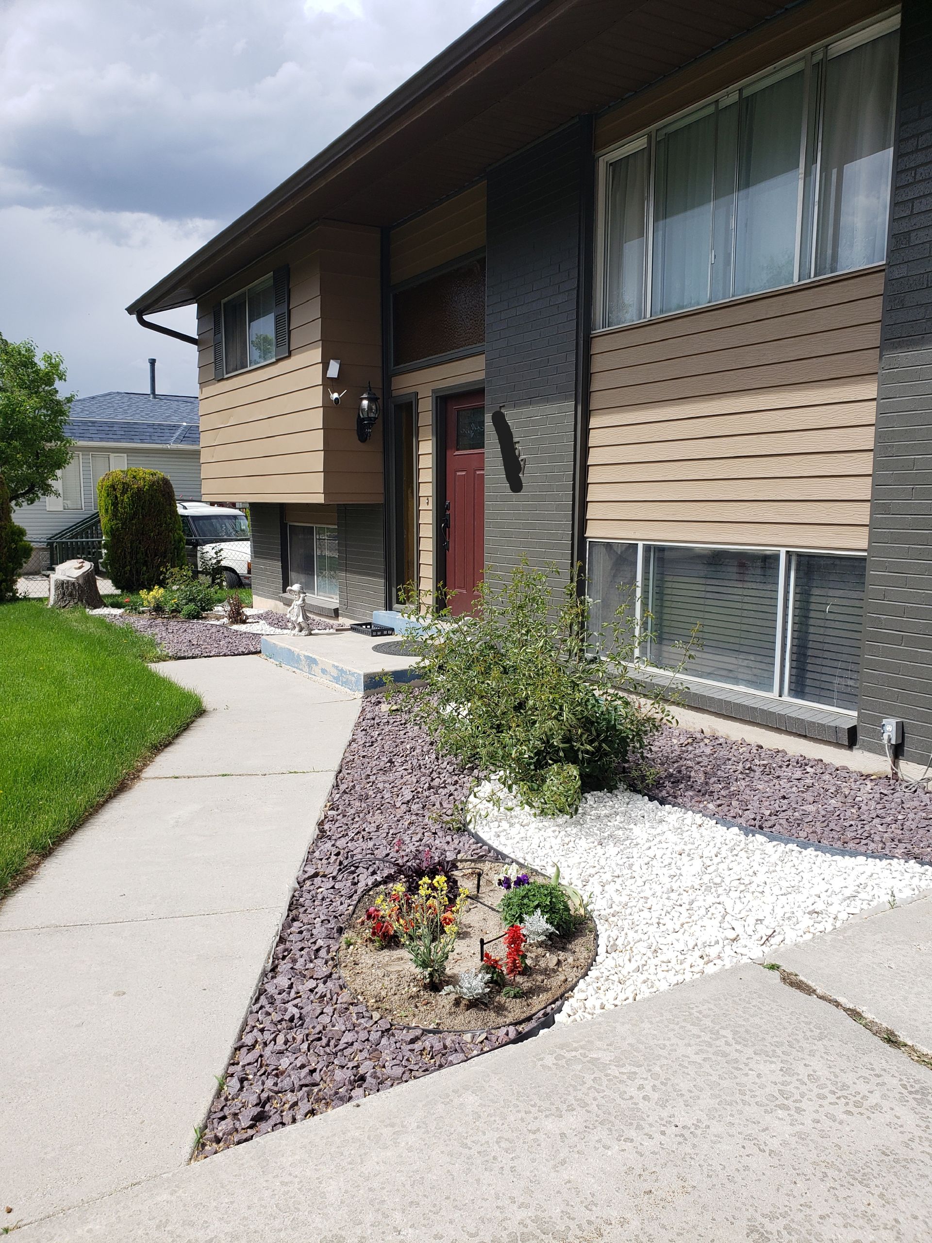 A large house with a walkway leading to it