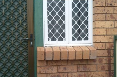 White-framed Window With Diamond-patterned Security Screen — Abundance Blinds In Lake Macquarie, NSW