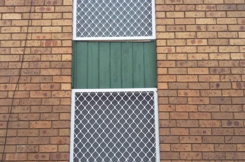 Window With Two Screen Windows and Green Panel — Abundance Blinds In Tuggerah, NSW