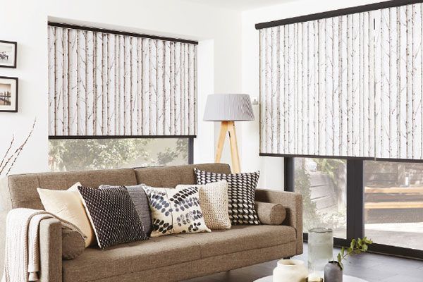 Living Room With Sofa, Pillows, Patterned Blinds, and a Lamp — Abundance Blinds In Charmhaven, NSW