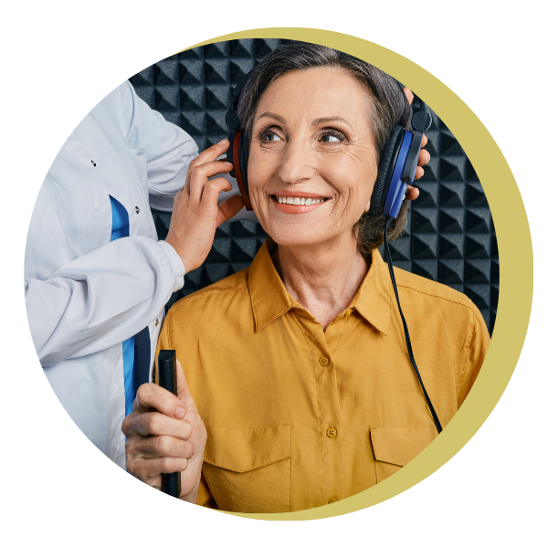A woman wearing headphones is being examined by a doctor.