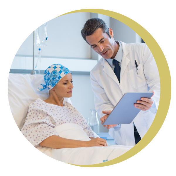 A doctor is talking to a patient in a hospital bed