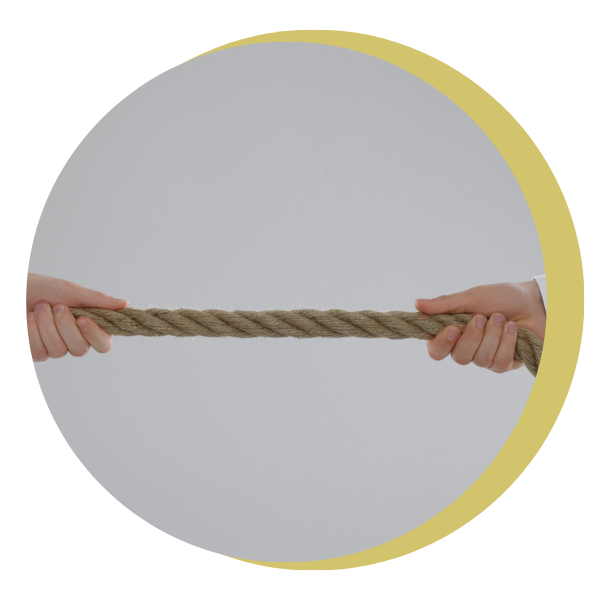 Two people are pulling a rope in opposite directions.