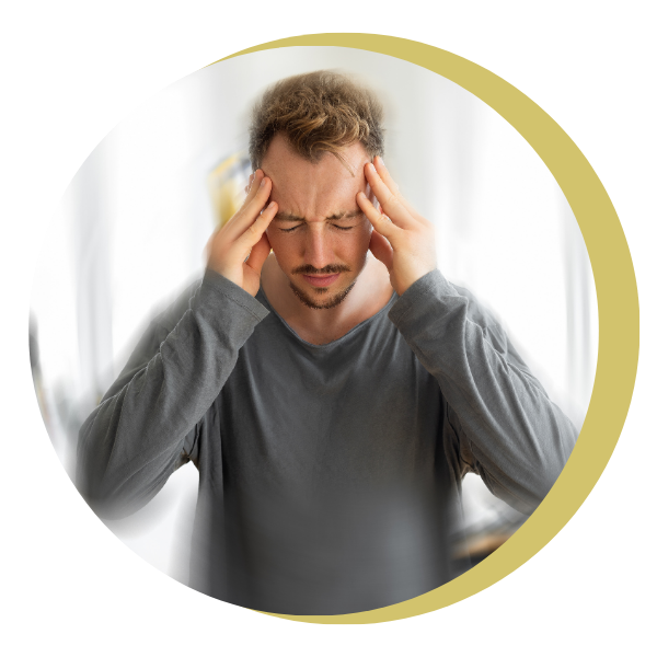 A man is holding his head because he has a headache