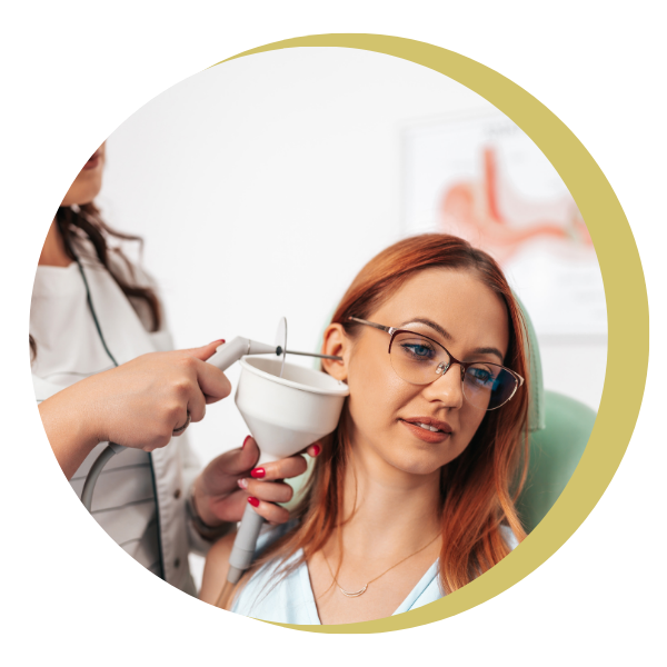 A woman is getting her ears examined by a doctor.