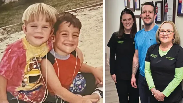 A couple of children sitting next to each other and a couple of people standing next to each other.
