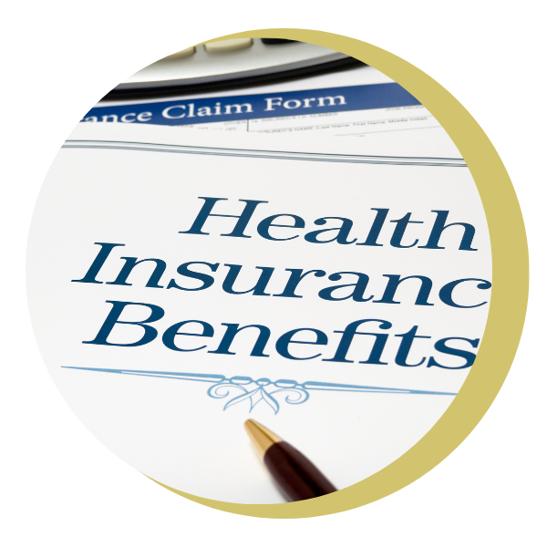 A person is holding a pair of hearing aids in their hand