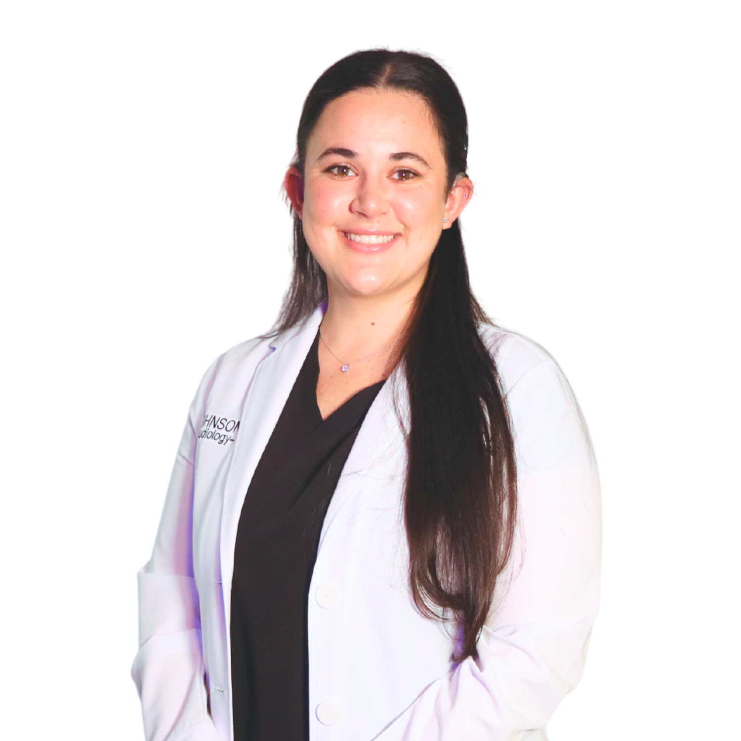 A woman in a white lab coat is smiling and holding a clipboard.