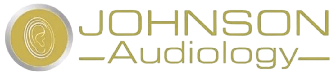 A logo for johnson audiology with a gold circle