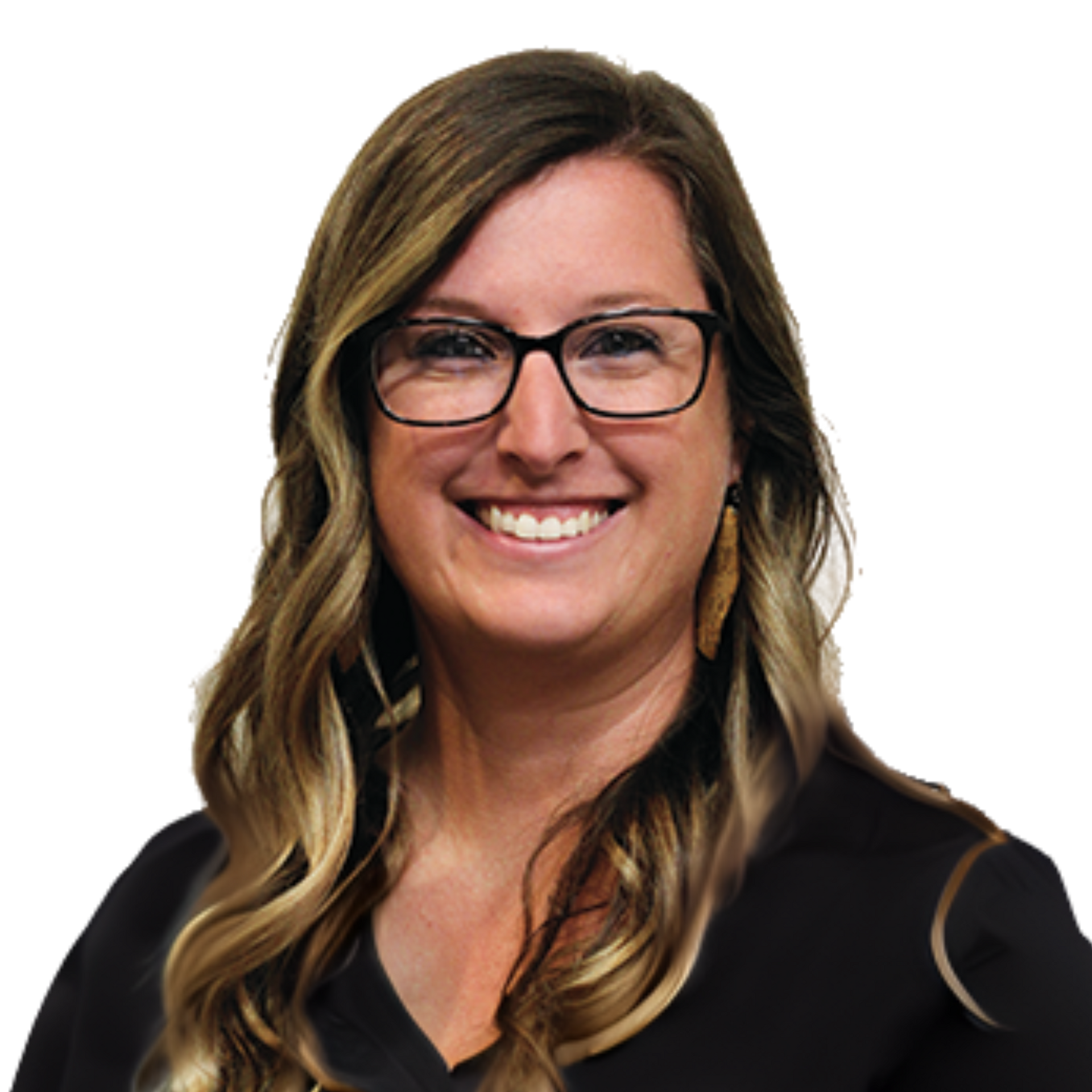 A woman wearing glasses and a scrub top is smiling for the camera.