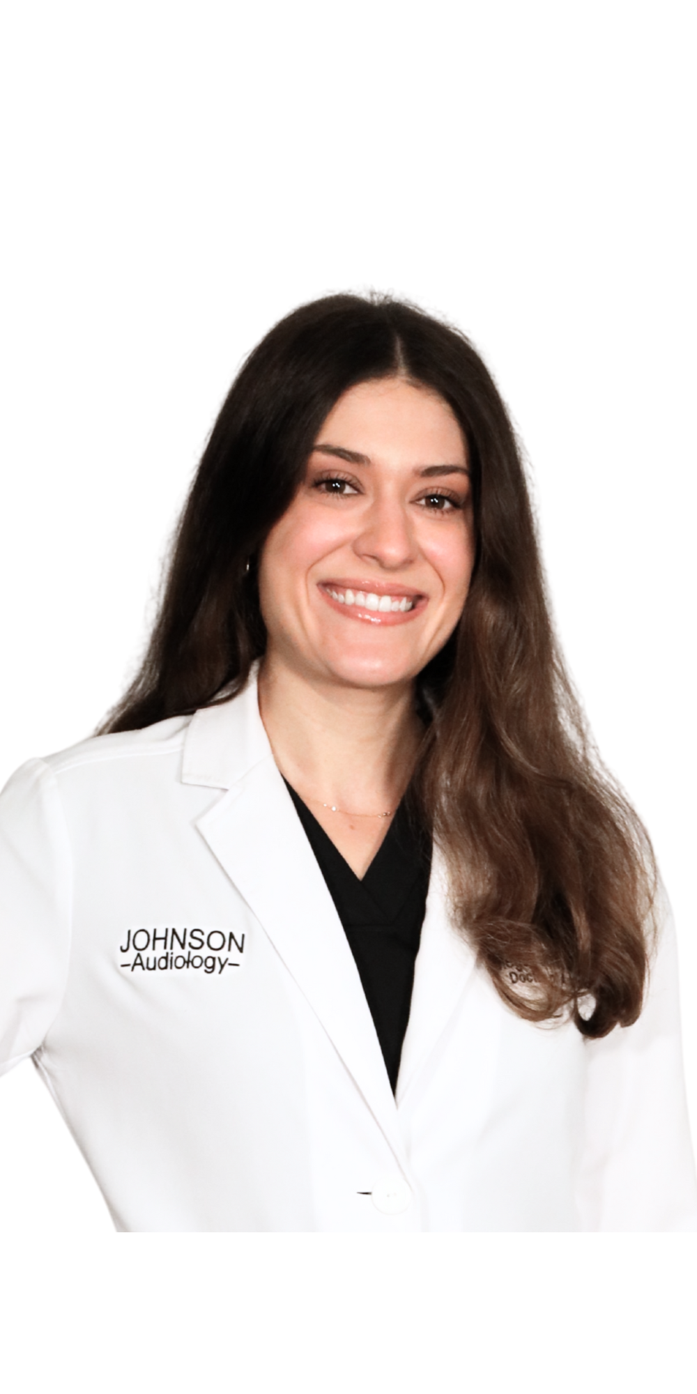 A woman in a white lab coat is smiling for the camera
