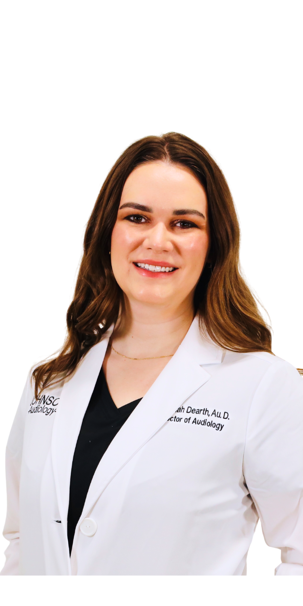 A woman in a white lab coat is smiling for the camera