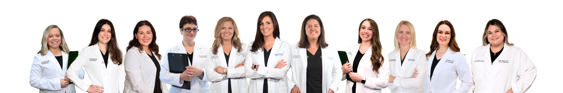 A group of doctors are standing in a row with their arms crossed.