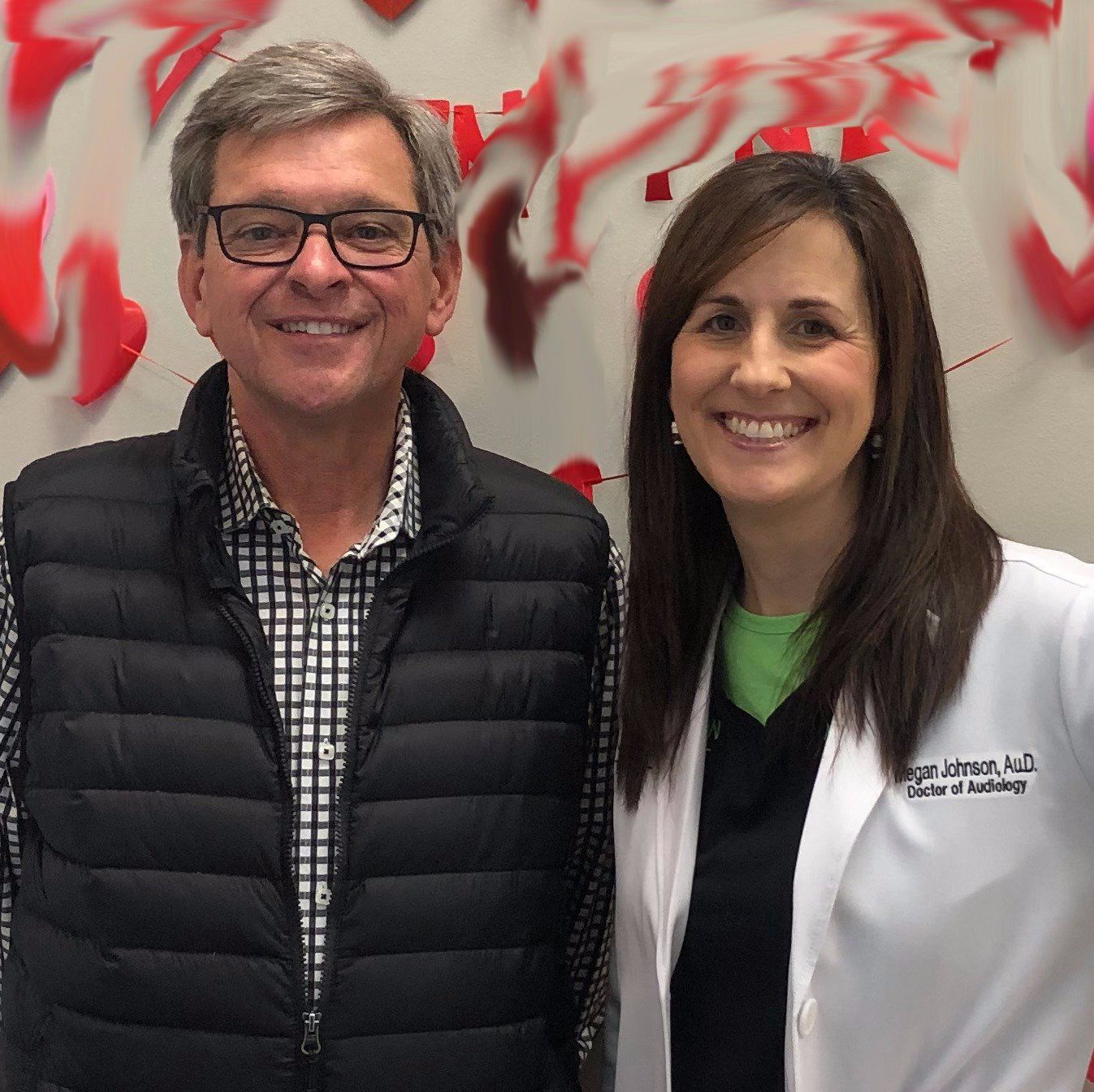 A man and a woman are posing for a picture together