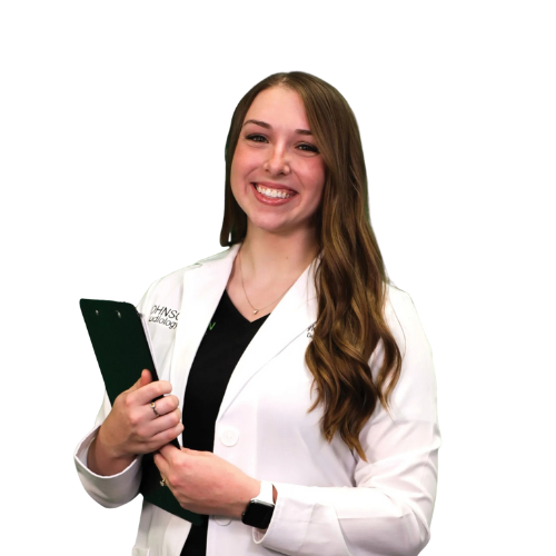A woman in a lab coat is holding a clipboard and smiling.