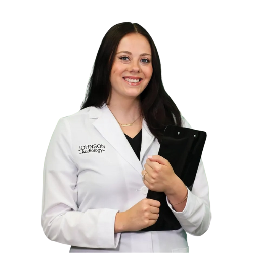 A woman in a white lab coat is holding a clipboard