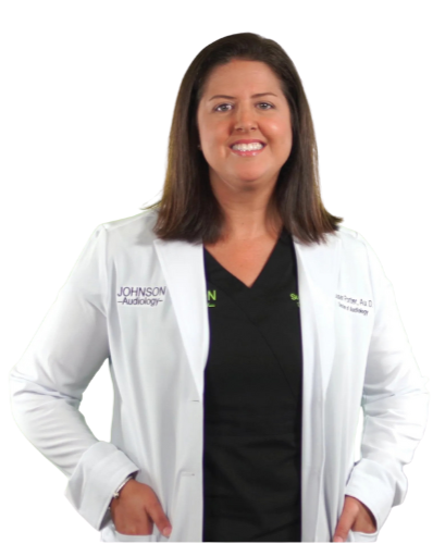 A woman wearing a lab coat with the name johnson on it