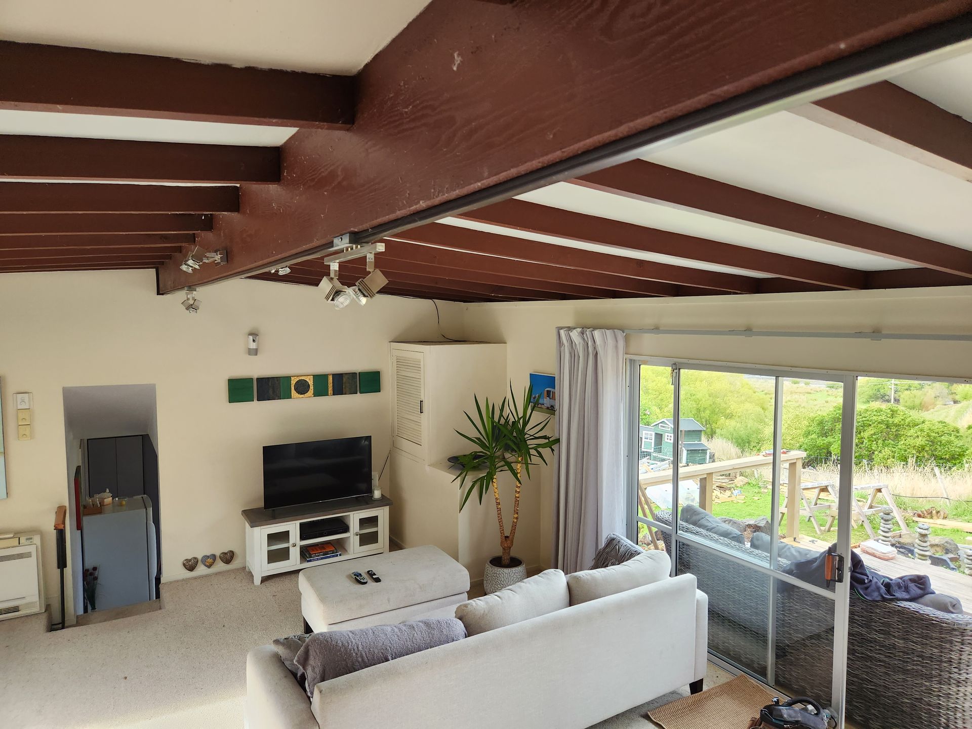 A living room with a couch and a television
