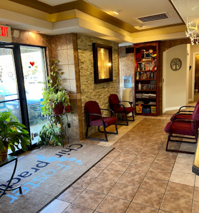 A man is giving a woman a massage on her back.