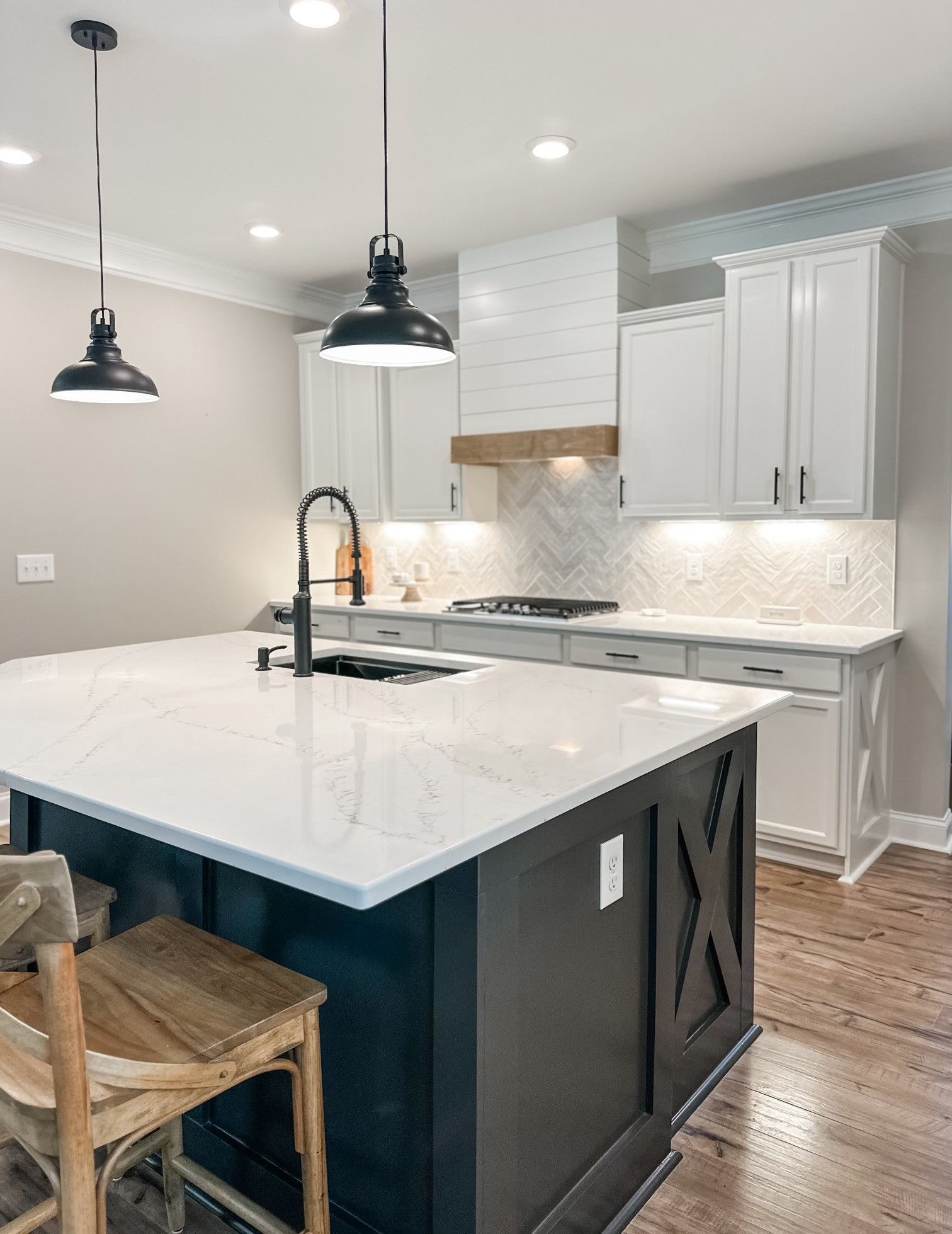A living room with a staircase leading up to the second floor