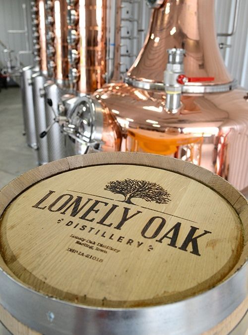 A wooden barrel with the word lonely oak on it