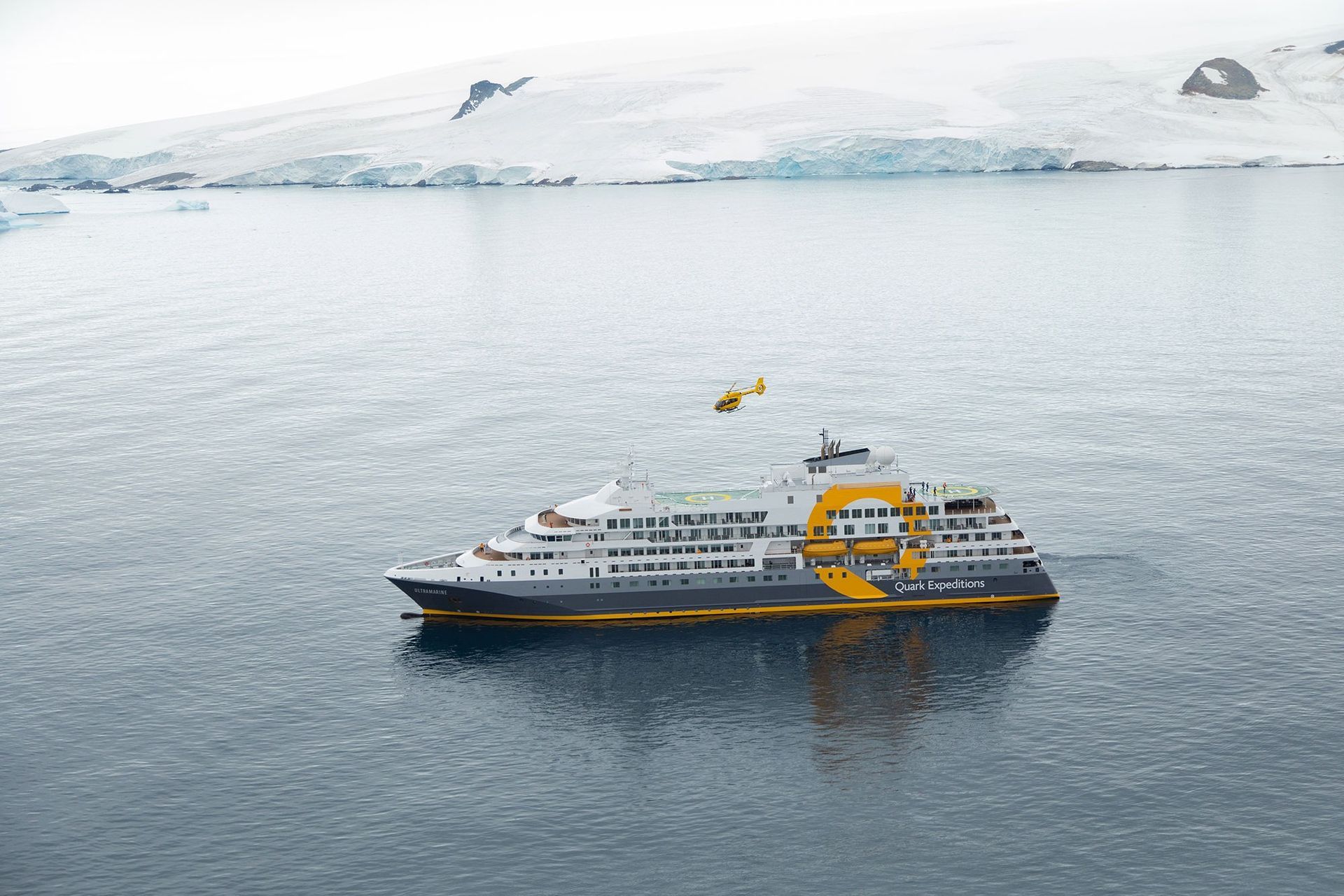 A large cruise ship is floating on top of a body of water.