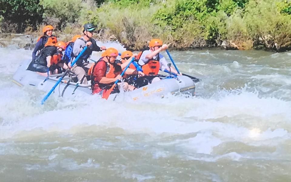 A group of people are rafting down a river.