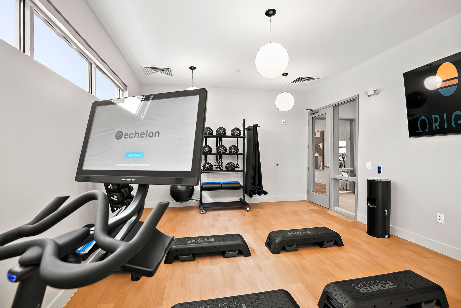 There is a bicycle in the middle of the room at Origin Apartments.