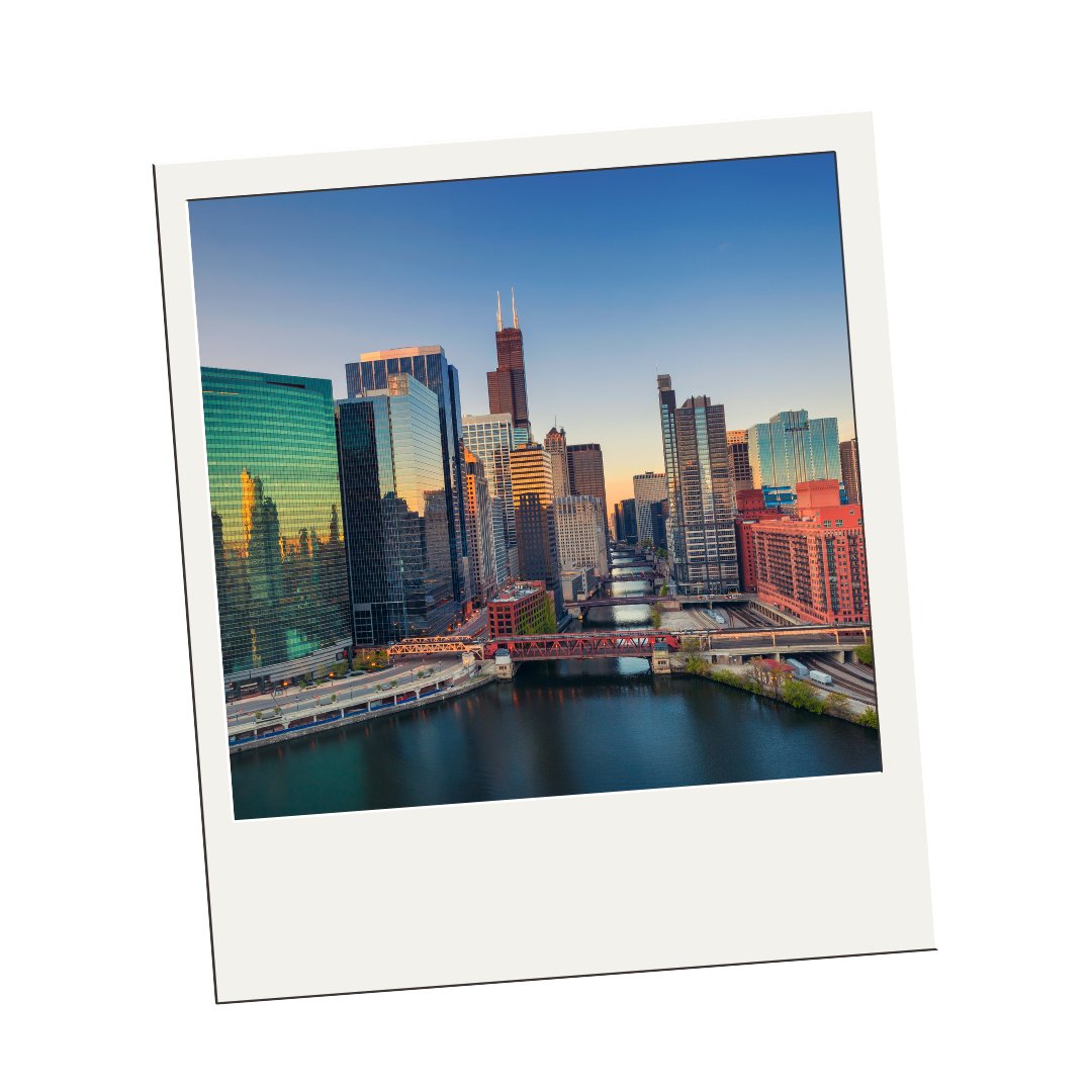 A polaroid picture of a city skyline with a river in the foreground.