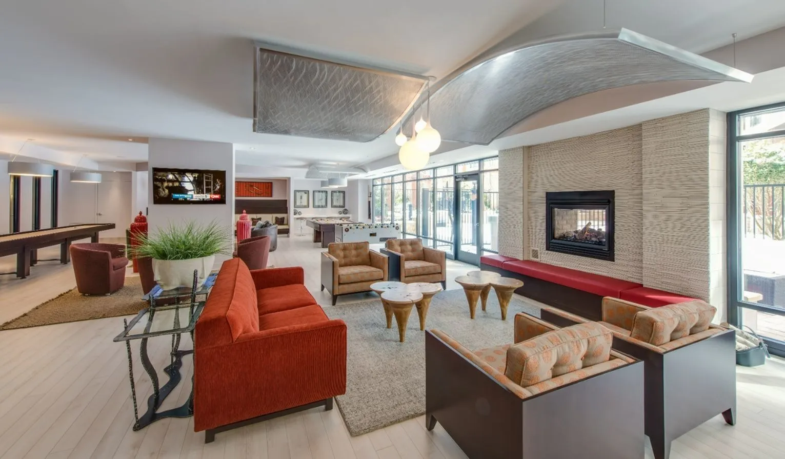 A living room filled with furniture and a fireplace.