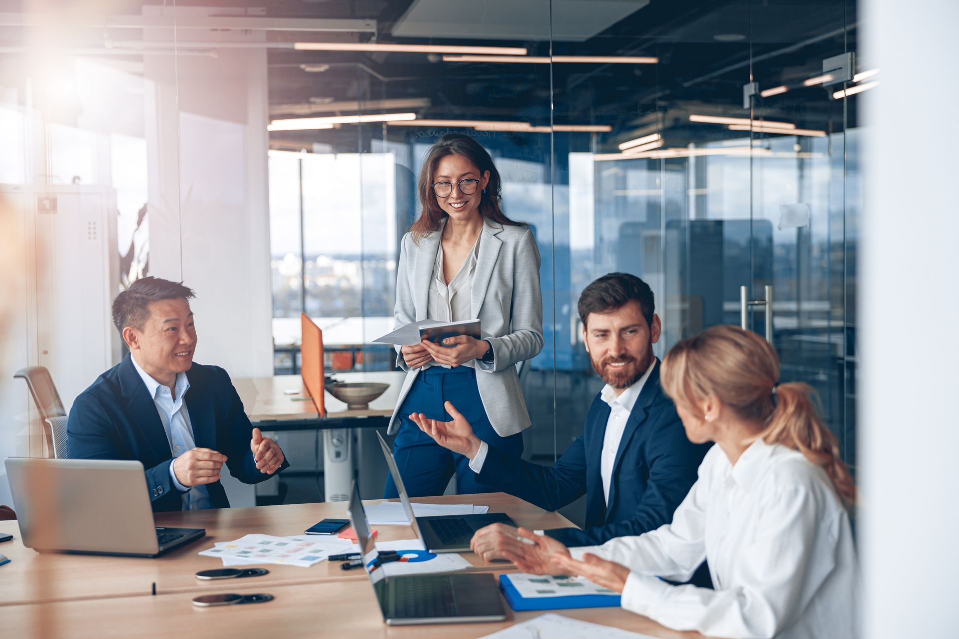 A group of business people are having a meeting in an office.