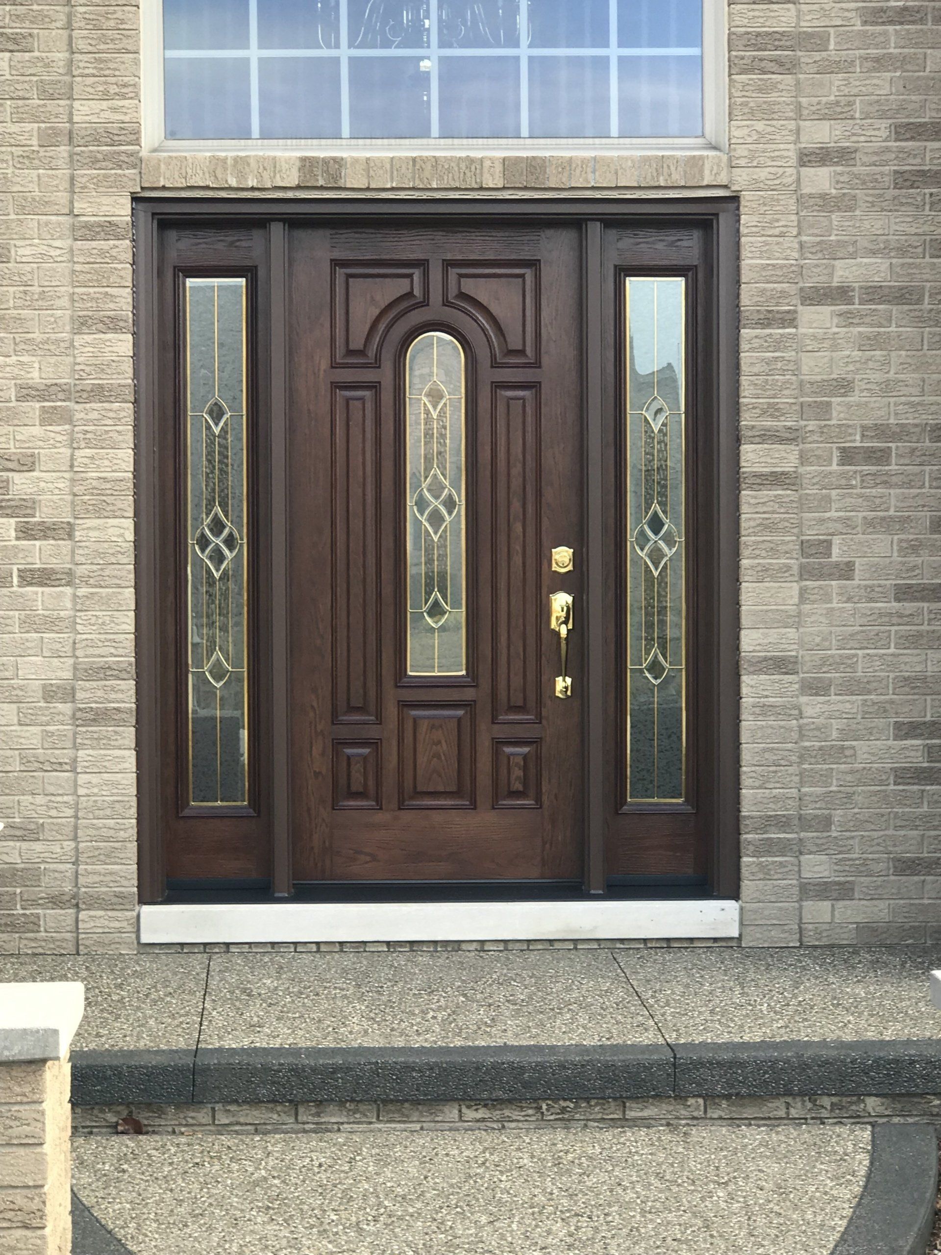 A brick building with a wooden door and a window
