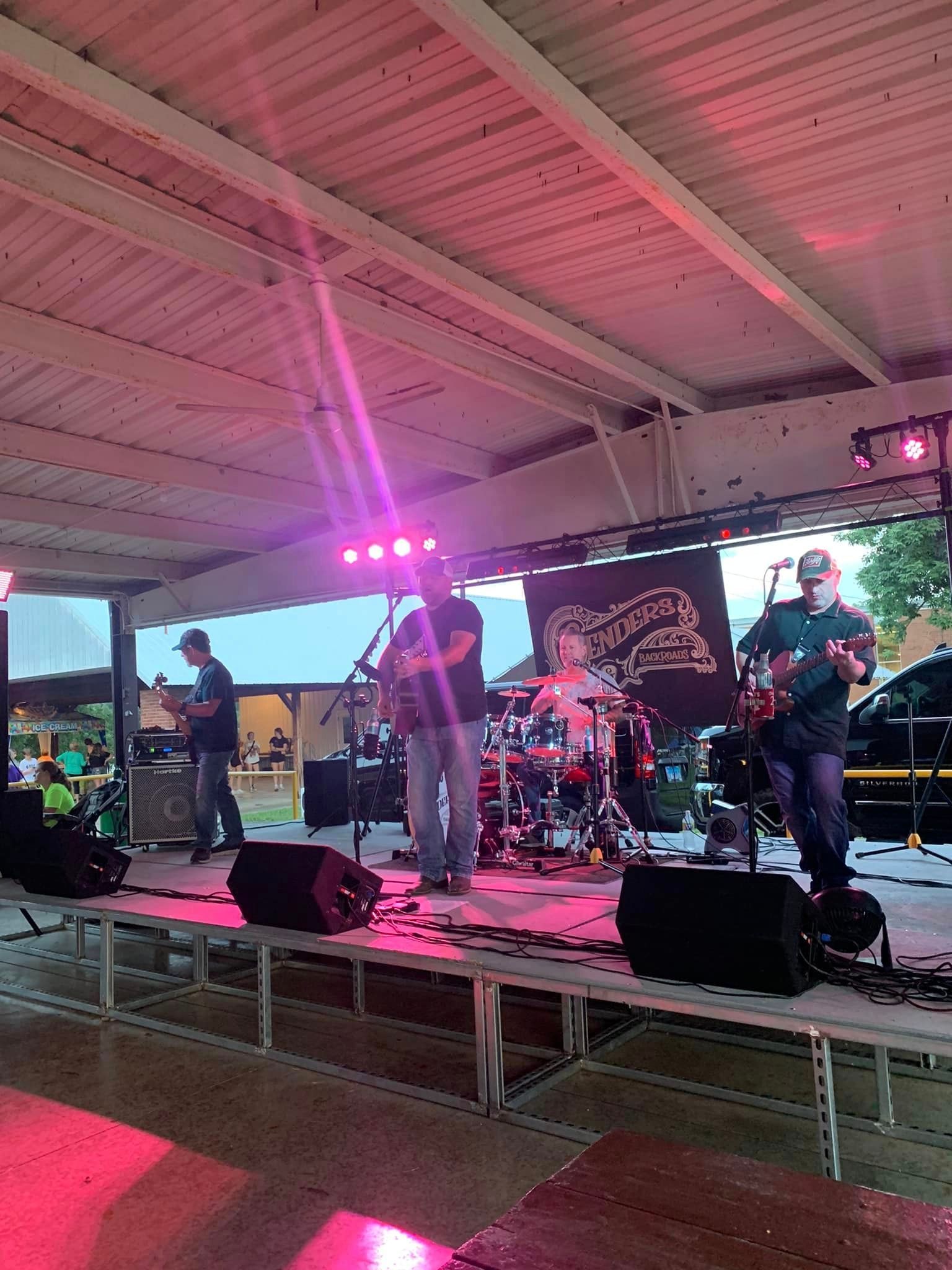 A group of people are playing instruments on a stage.