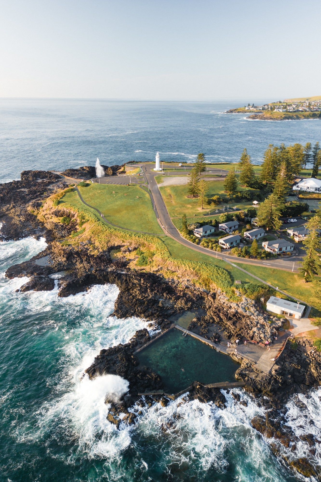 Aerial View Of A Rugged Coastline With Some Houses — Dr John Salmon, Kiama Family Dental In Kiama, NSW