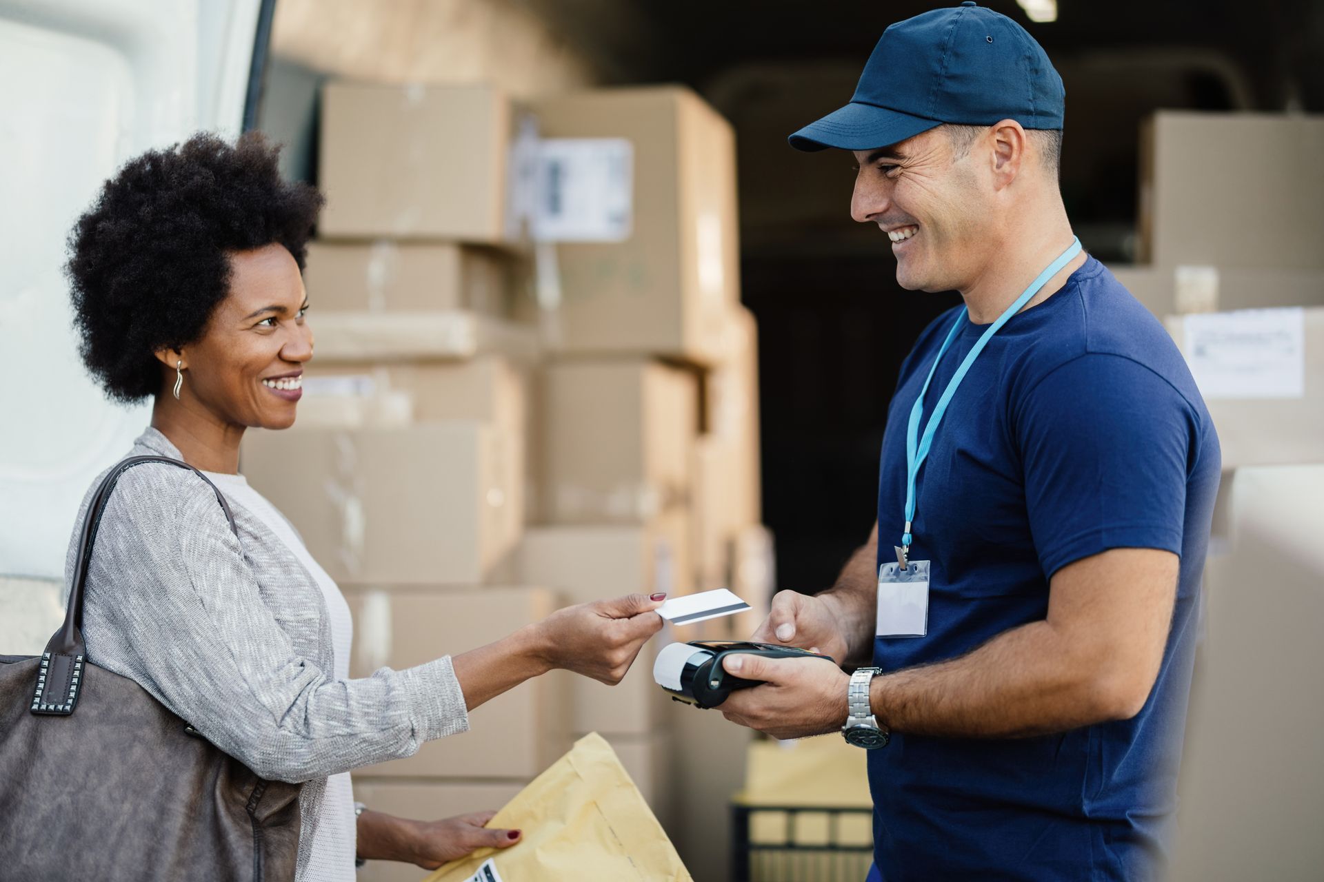 woman picking up her package from amazon delivery driver 