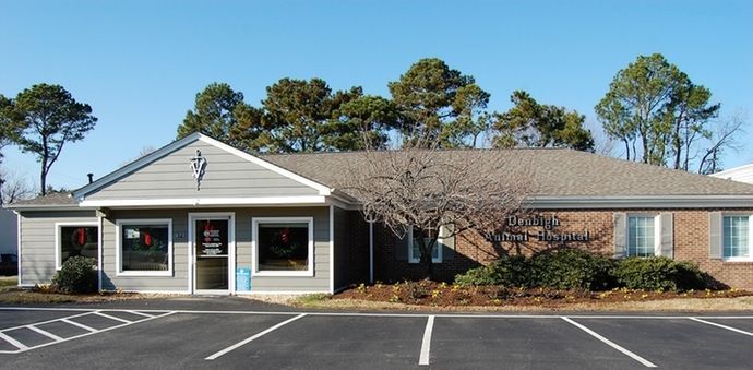 A building with a parking lot in front of it