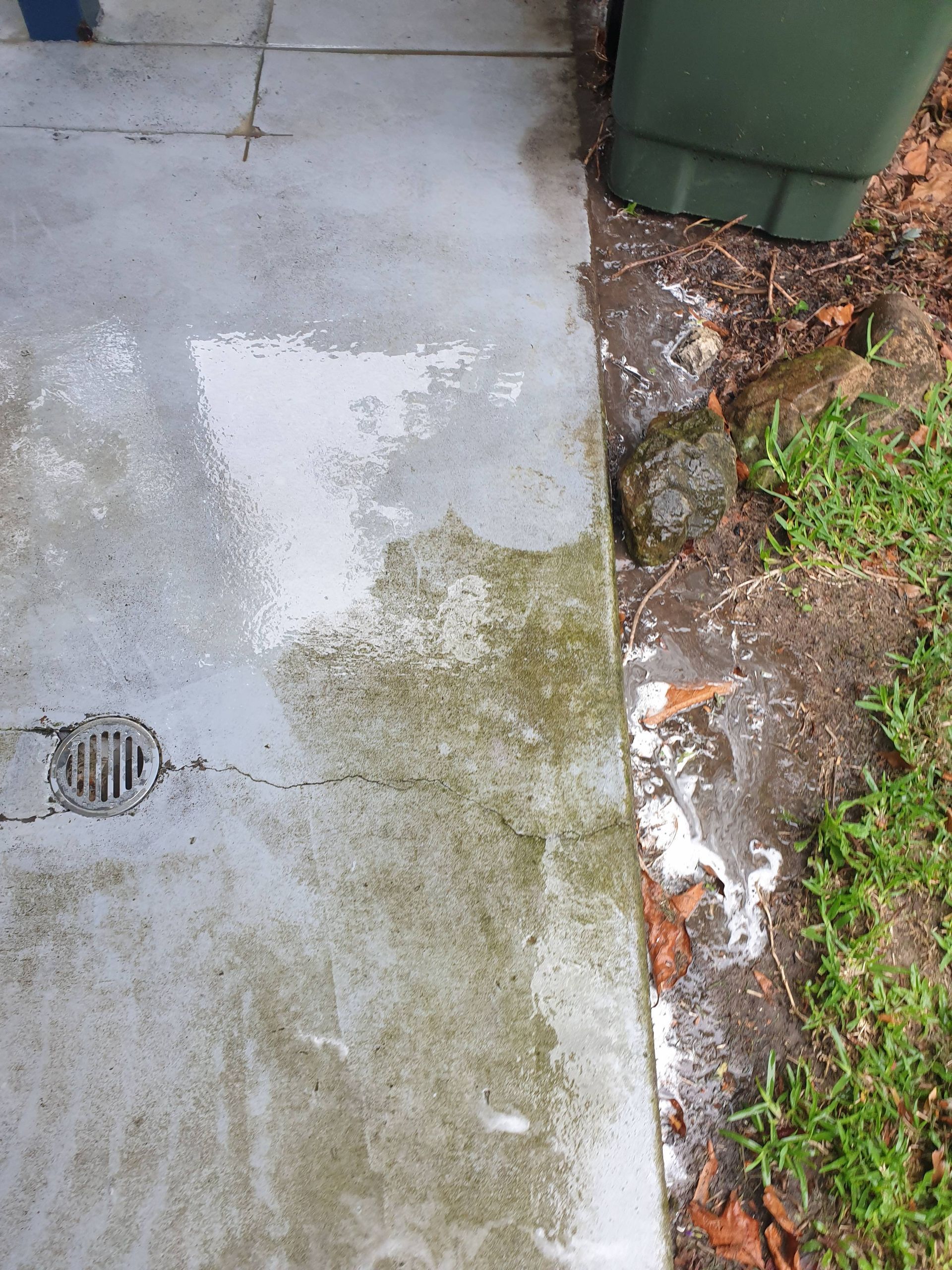 A Concrete Footpath Is Being Cleaned — Magic Wand Roof Restoration & Painting in Tweed, NSW